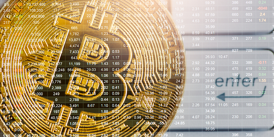 Bitcoin golden coin on a trading chart.