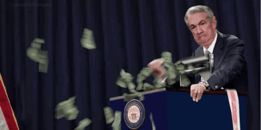 A man throwing money from a speaking post.
